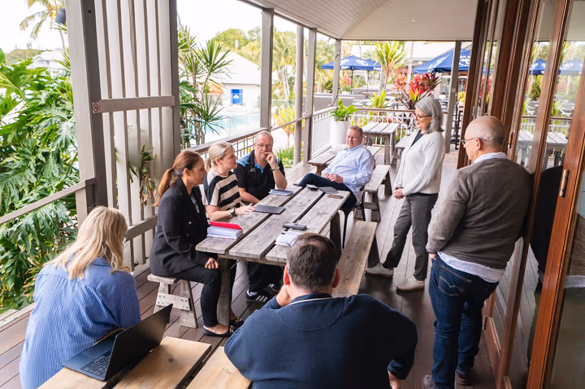 Team discussion at an outdoor workspace