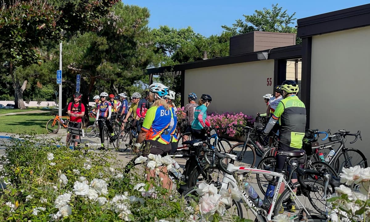 Riders gathering at Deerfield Community Park before a Saturday ride