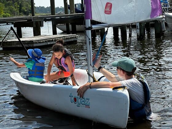 Young sailors on the water at ETYSA summer camp in New Bern, North Carolina