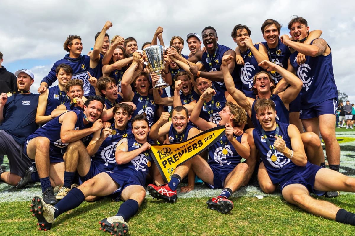 PFL premiership celebration — players holding trophy