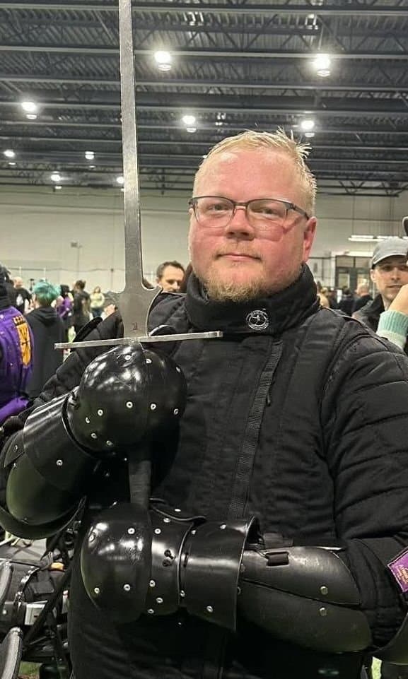 Taylor Hodne, treasurer, at a HEMA tournament in protective gear