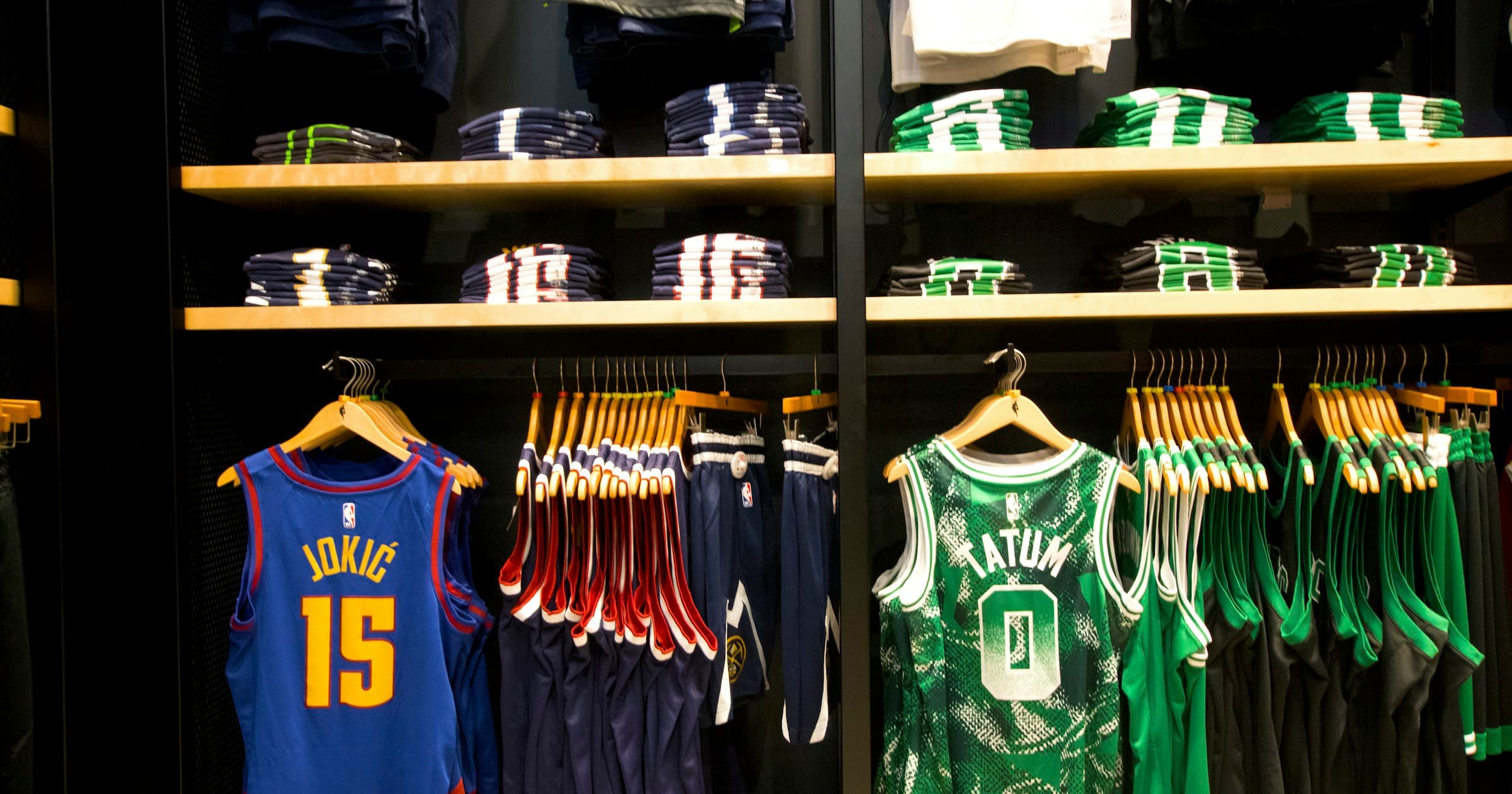 Team jerseys and club apparel displayed on shop shelves